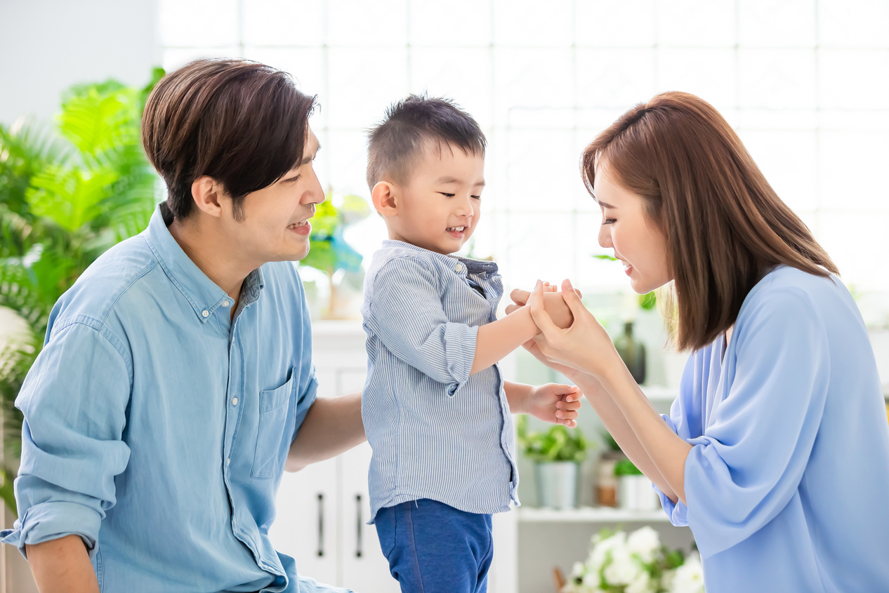 Young Parents Playing with Child